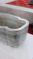 Font for Christian baptism of an infant. Baptismal font, baptistry, baptismal pool, baptizing vessel, baptizing basin. video