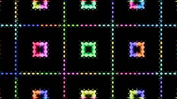 Colorful geometric patterns pulsate rhythmically in a vibrant light display video