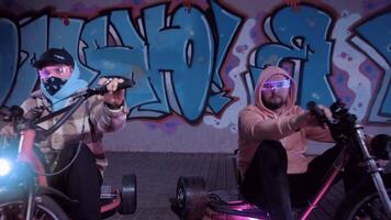 Experience an exciting night ride on colorful electric hoverboards in an urban setting video