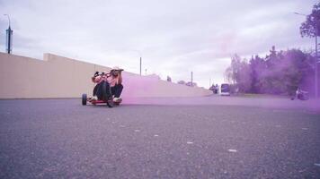 Experience a Dynamic and Exciting Bike Ride Enhanced with a Colorful Smoke Effect video