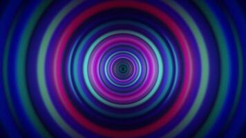 A colorful circular background with a blue, green and purple color video