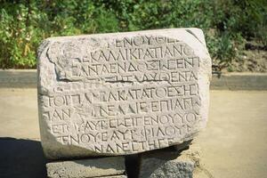 A stone with writing on it photo