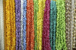 Colorful yarns for sale in a store photo