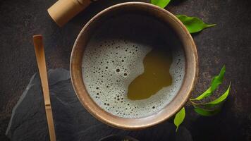 Top view of Matcha Tea Composition with whisk and bamboo spoon video