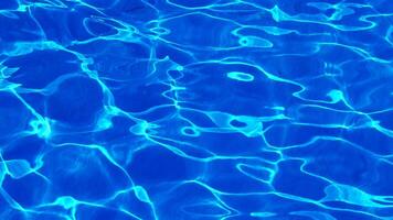 Water in the pool, sunlight is reflected, waves. Reflection and glare. Sun Glare in the Water in the Pool. video