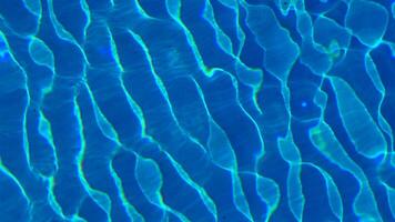 Water in the pool, sunlight is reflected, waves. Reflection and glare. Sun Glare in the Water in the Pool. video