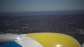 Earth from the airplane window. View of land and city from the airplane video