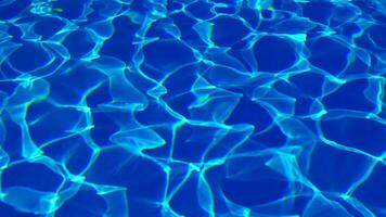 Water in the pool, sunlight is reflected, waves. Reflection and glare. Sun Glare in the Water in the Pool. video