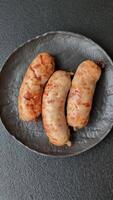 Grilled sausages with spices and herbs. Top view flat lay. With copy space video