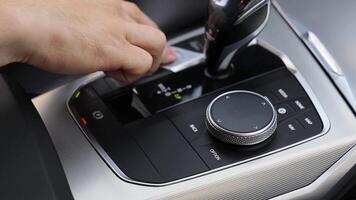 A modern car interior featuring an advanced gear shift and display dial for enhanced functionality video