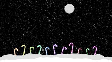 A snow covered field with candy canes and a full moon video