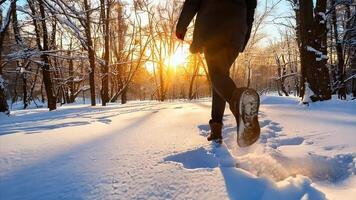 Close Up Shot of a woman's leg bottom view walking on a snowy day video