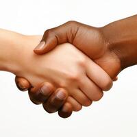Hands from different backgrounds shake in unity symbolizing friendship and collaboration photo
