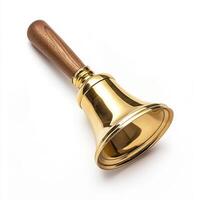 Golden hand bell with wooden handle on white background photo
