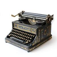 Vintage typewriter with ornate golden details on white background photo