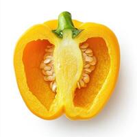 Yellow bell pepper cut in half, showing seeds and texture on white background photo