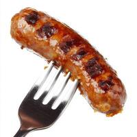 A close-up of a perfectly fried sausage skewered on a shiny stainless steel fork, isolated on a clean white background photo