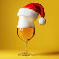 Beer and hat of Santa Claus on a yellow background photo