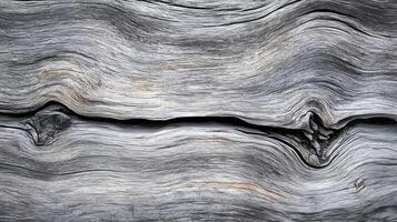Muted gray driftwood texture with subtle grain patterns and a smooth photo