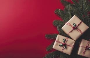 Three brown boxes with red ribbons on top of a red background photo