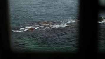 View of Ocean Rocks Through Window video
