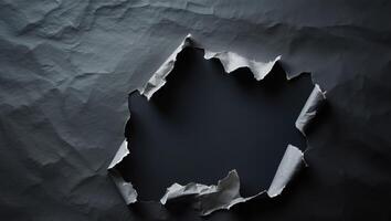 Torn Paper Background with Rip and Hole Effect on Dark Surface photo