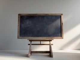 An old blackboard on a wooden stand in front of a window photo