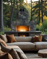 Cozy modern living space with soft seating and a warm fireplace in a serene natural setting during daylight hours. photo