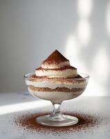 A dessert in a glass bowl with a scoop of chocolate photo