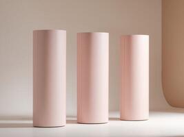 Three pink cylindrical objects sit on a table photo