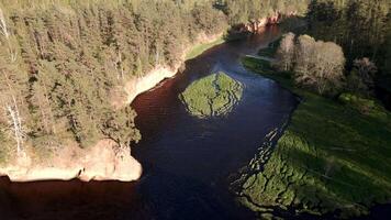 Elevated View of River with Grassy Island and Sandy Cliff video