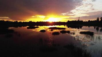 Sunset Over Water with Reflections of Trees and Power Lines video