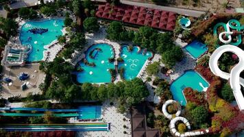 Aerial View of Water Park with Pools, Slides, and Pirate Ship Area video