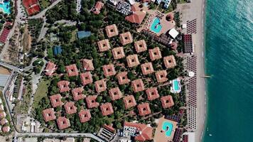 Aerial View of Coastal Resort with Geometric Layout and Red Tiled Roofs video
