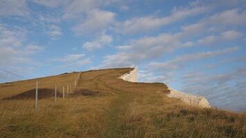White Cliffs of Dover with Lone Figure and Partly Cloudy Sky video