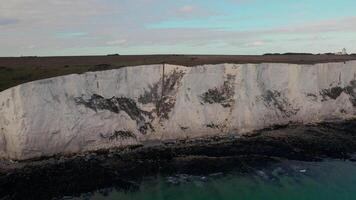 White Cliffs of Dover with Distant Lighthouse and Partly Cloudy Sky video