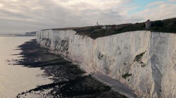 White Cliffs of Dover with Lighthouse and Buildings in England video
