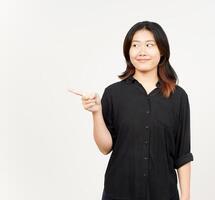 Showing Product and Pointing Side of Beautiful Asian Woman Isolated On White Background photo