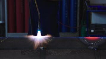 Welding Process with Torch and Metal Surface in Workshop Setting video