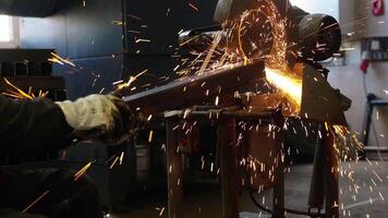 Worker Using Metal Cutting Saw in Industrial Workshop Setting video