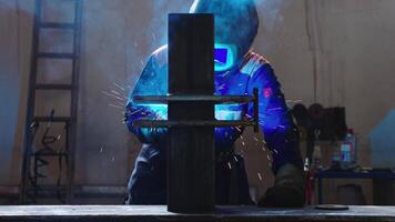 Welder in Protective Gear Working in Dimly Lit Workshop video