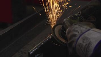Close Up of Worker Using Angle Grinder with Sparks in Industrial Setting video