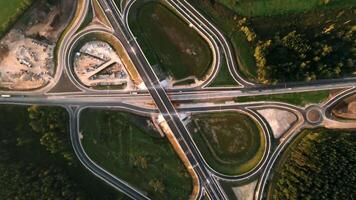 Aerial View of Complex Highway Interchange with Forested Areas video
