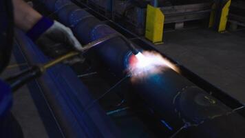 Welding Torch in Use on Large Metal Pipe in Industrial Setting video
