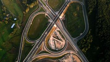 Aerial View of Highway Interchange Under Construction with Green Fields video