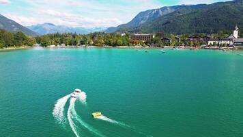 Vibrant Lake Scene with Boat and Inflatable in Austrian Alps video