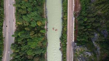 Aerial View of River with Rafts, Road, and Railway in Austria video