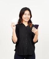 Holding smartphone and blank credit bank card of Beautiful Asian Woman Isolated On White Background photo