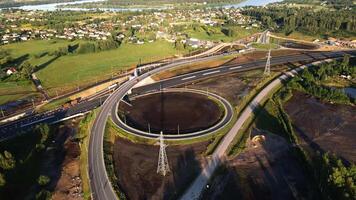 Aerial View of Highway Interchange with Roundabout and River video