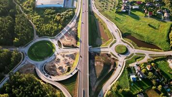 Aerial View of Highway with Roundabouts and Surrounding Nature video